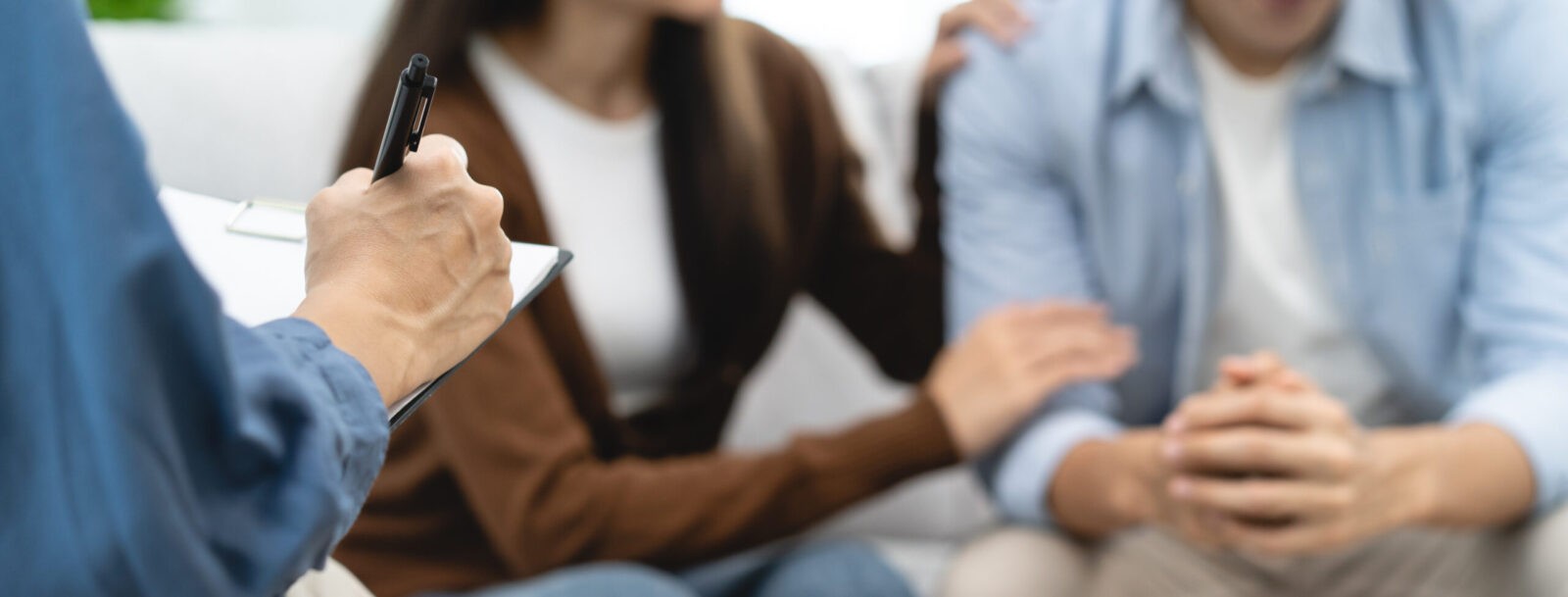 couple relationship therapy with a counselor. Close Up hands of the woman client during a conversation with psychologist to find problems and solution. couple relationship therapy with a counselor. Close Up hands of the woman client during a conversation with psychologist to find problems and solution.
